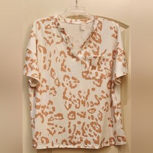 New Tan/White leopard print, short-sleeve pocket Tee. 95% Polyester 5% Elastane